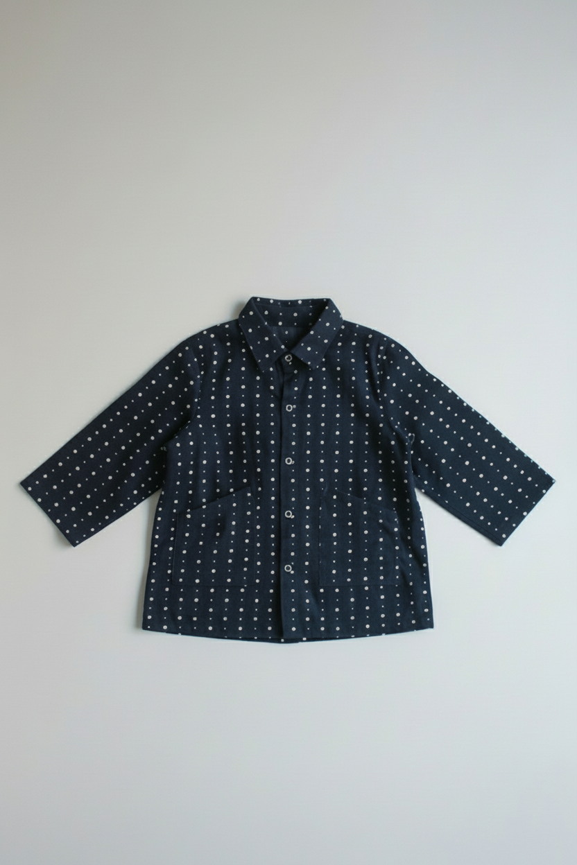 Navy blue shirt with white pattern on a light gray background