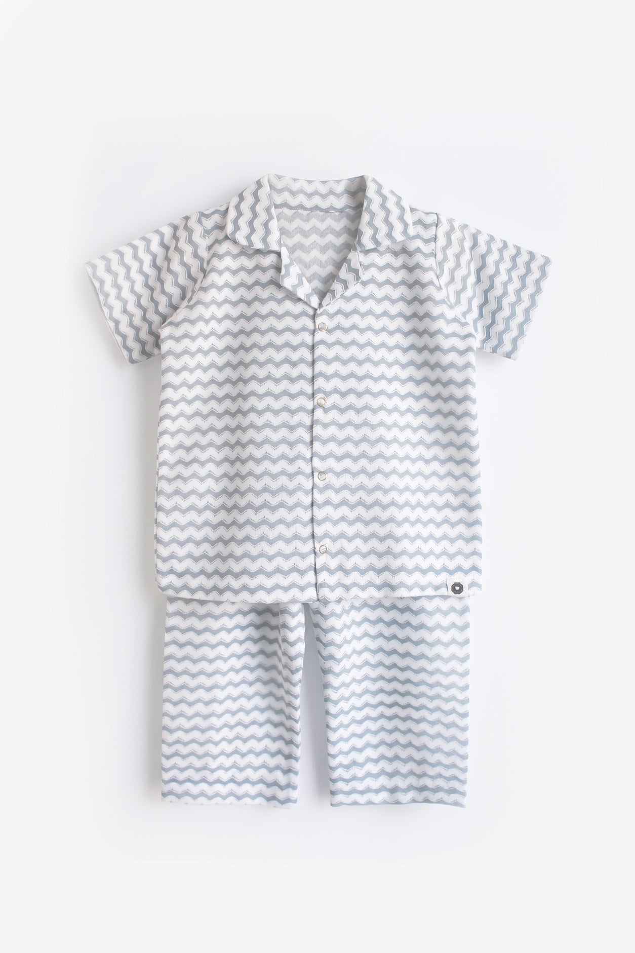 Baby romper with zigzag pattern on a white background