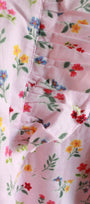 Close-up of a floral patterned fabric with pink background